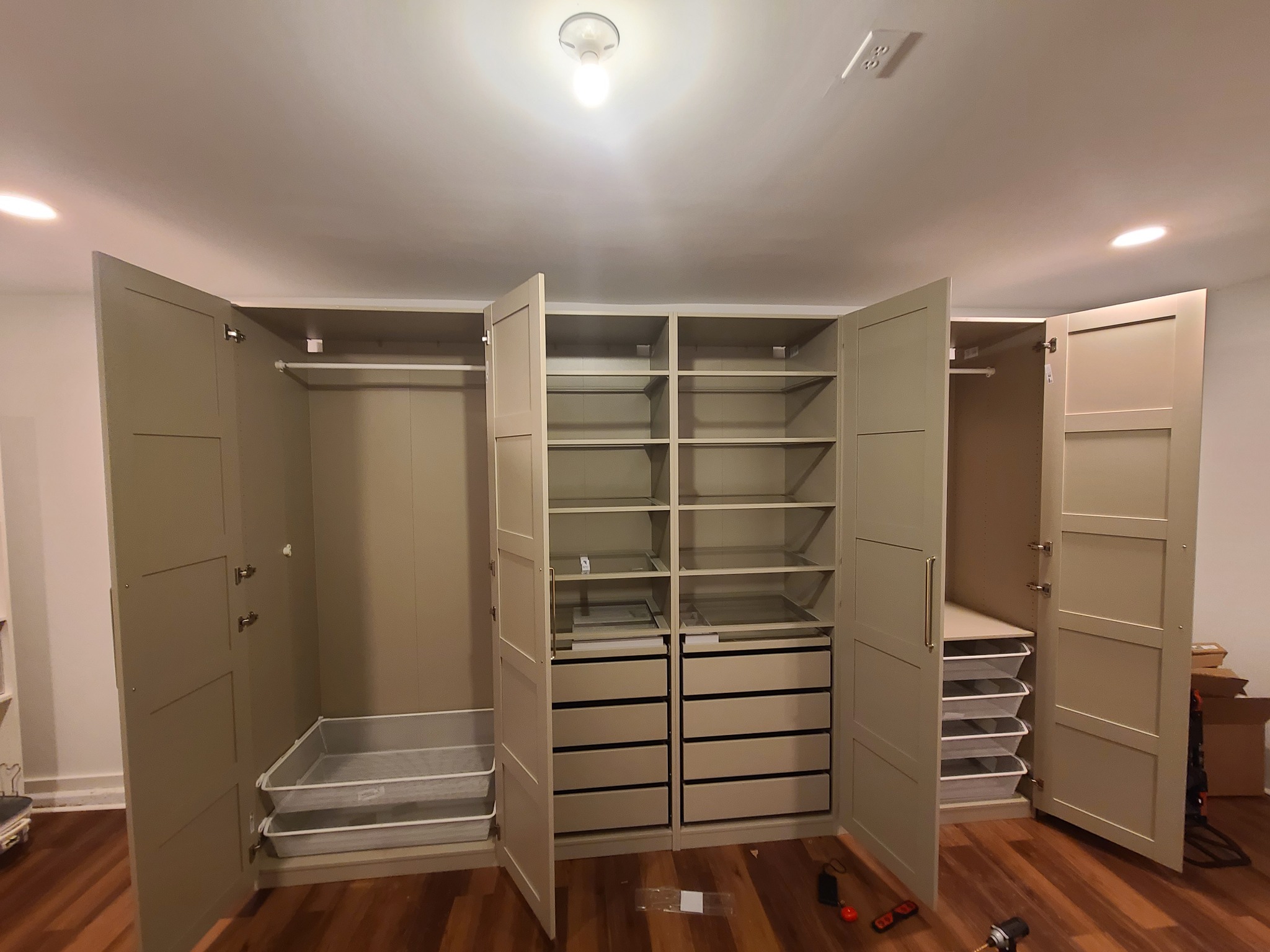 Assembled wardrobe with doors, drawers and shelves